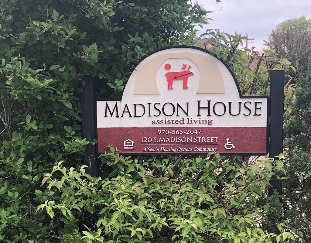 The Madison House Assisted Living sign at 120 S Madison Street in Cortez, Colorado